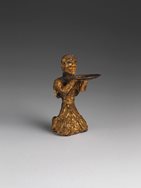 Gold kneeling figure