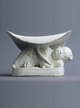 View Porcelain Pillow in the shape of a Reclining Boy, Ding Ware