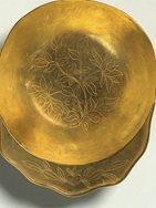 8. Gold cup with chased decoration