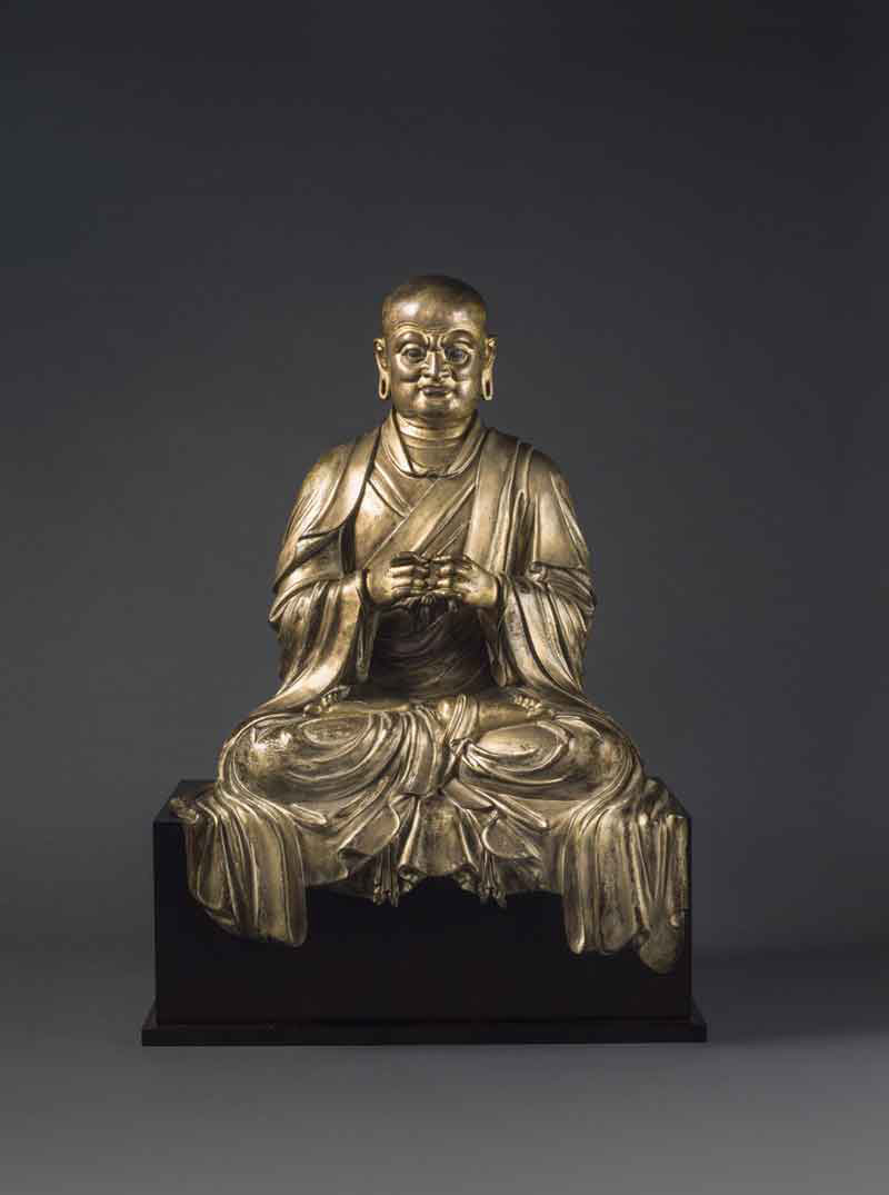 Gilt lacquered bronze figure of a Luohan
