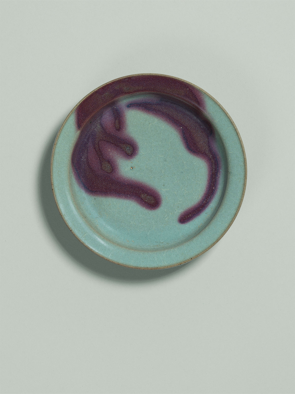 11. Blue-glazed splashed stoneware dish