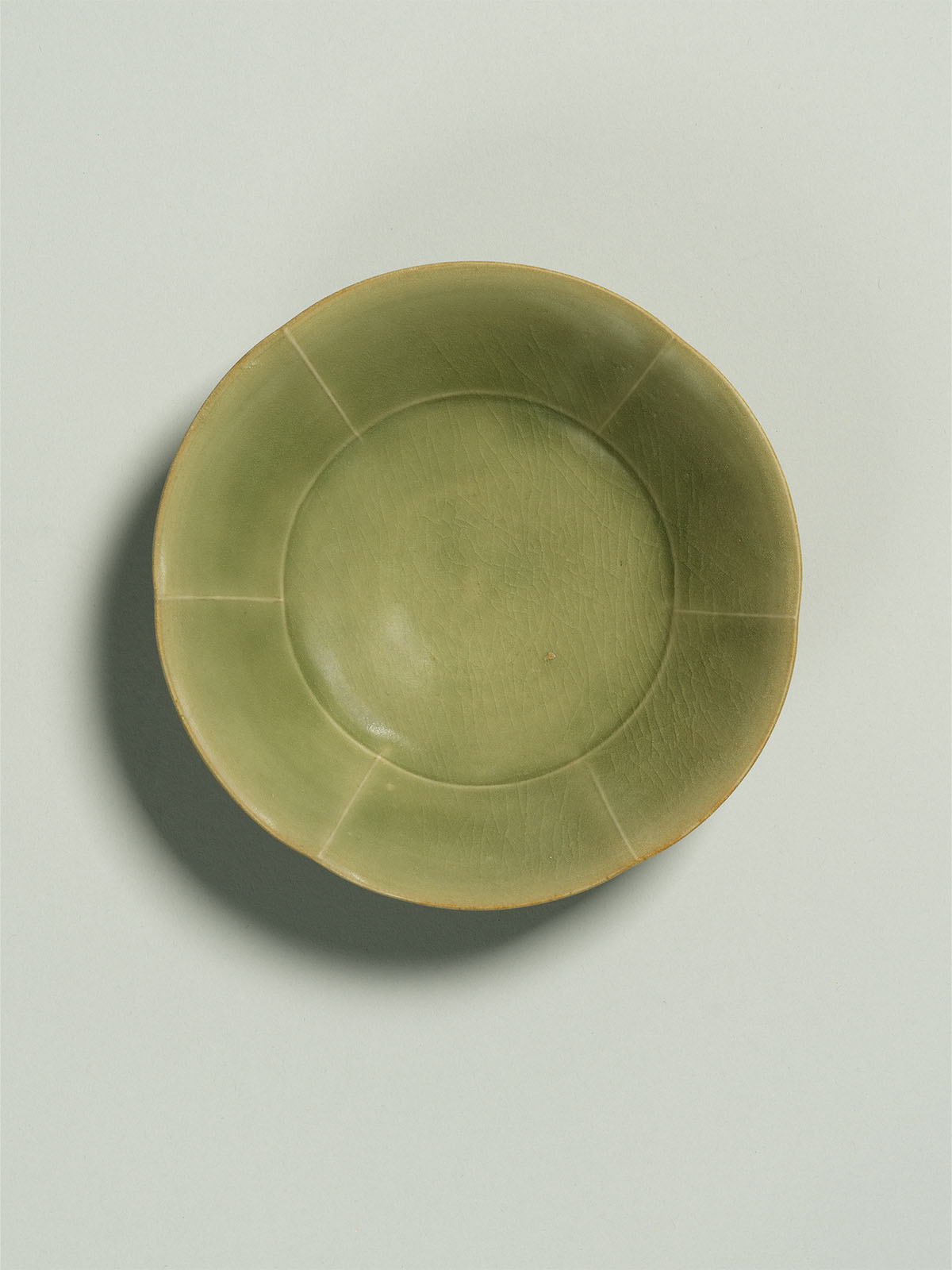 4. Green-glazed stoneware dish