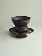 17. Black-grey-glazed haikatsugi stoneware tea bowl and mother-of-pearl inlaid lacquer tea bowl