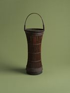1. Drum-shaped flower basket made from old arrow shafts