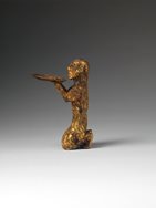 Gold kneeling figure